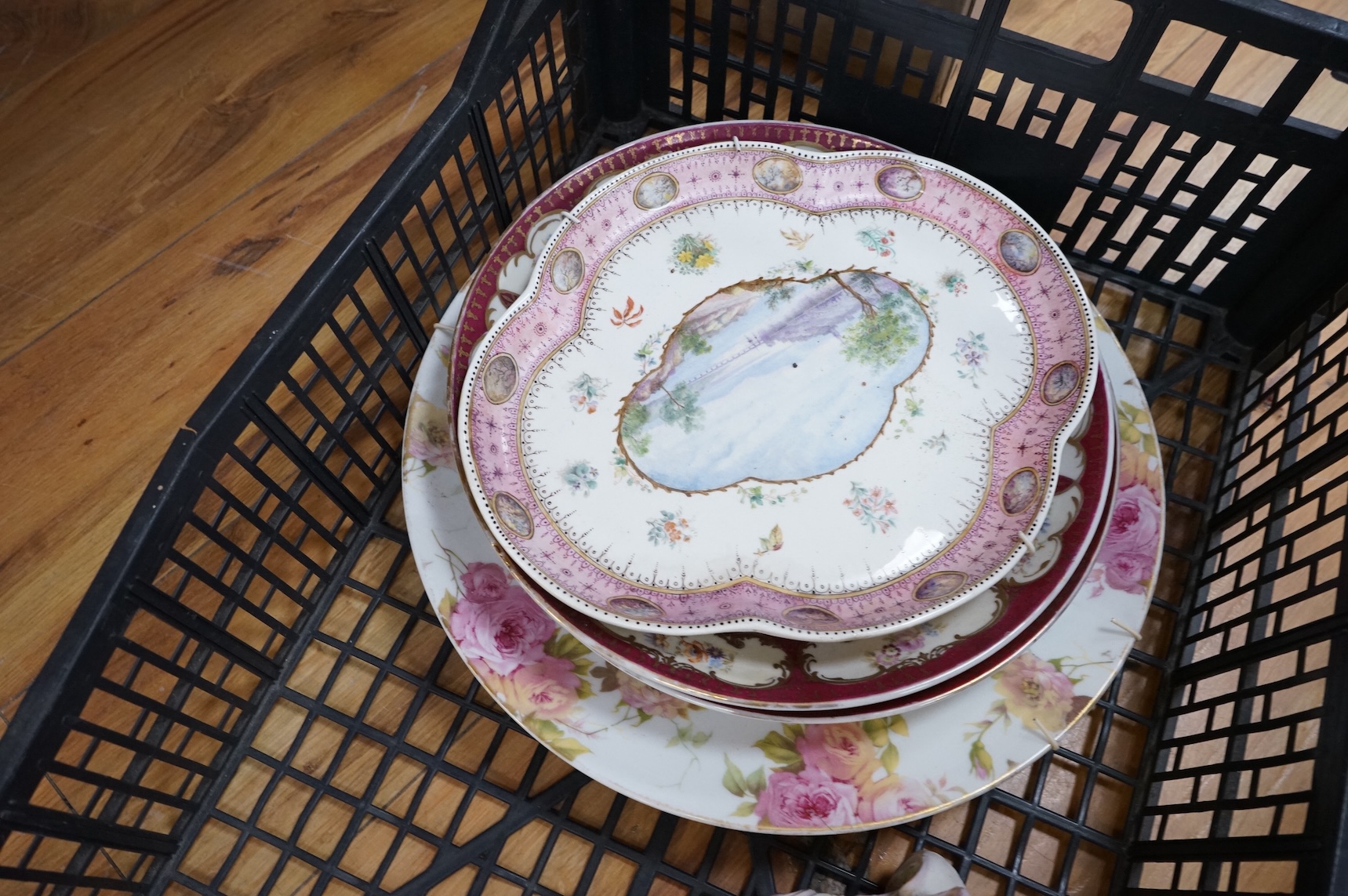 A German porcelain figural centrepiece, lobed dish, three other plates and two others